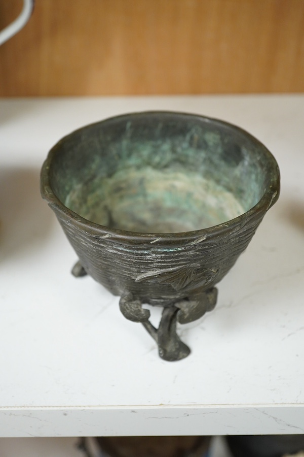 A Japanese bronze censer shaped as a basket on three legs. 8.5cm high.